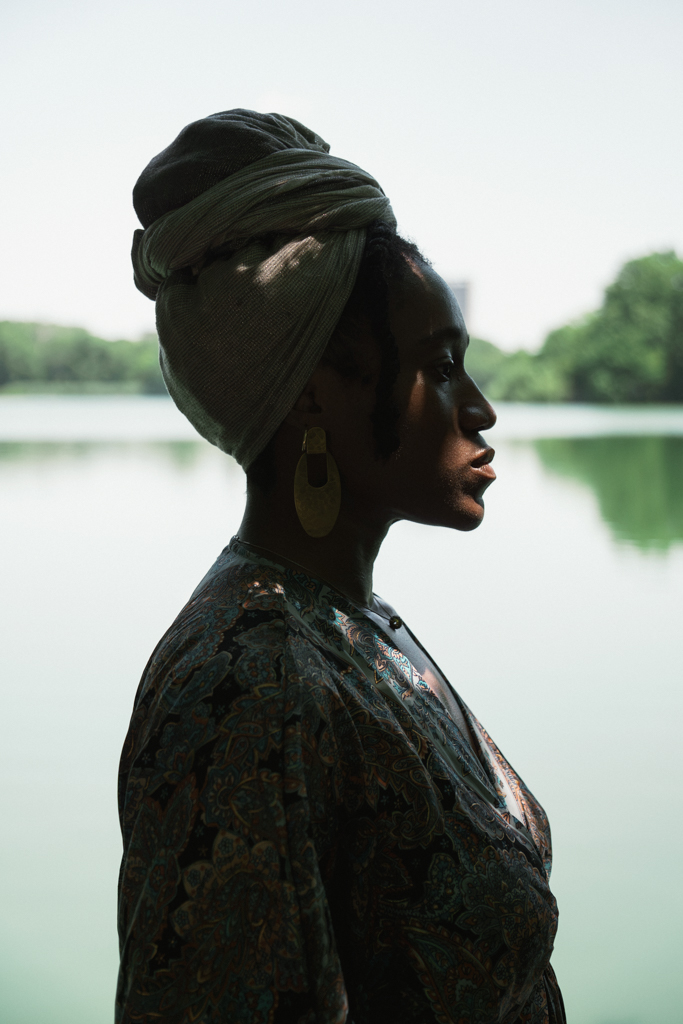 Jasmine in profile beside water